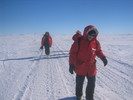 Walking the trail.  The Ice Runway is on the horizon at right.  In the distance is the Royal Society Range.