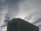 The sun behind the highbay.  Note the sunlight refracted in the ice crystal clouds.