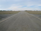 The road out to the pad. The cross road is the circumferential road which rings the launch site.